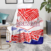 Croatia blanket on chair, CROATIA text with red and blue geometric flag print on white