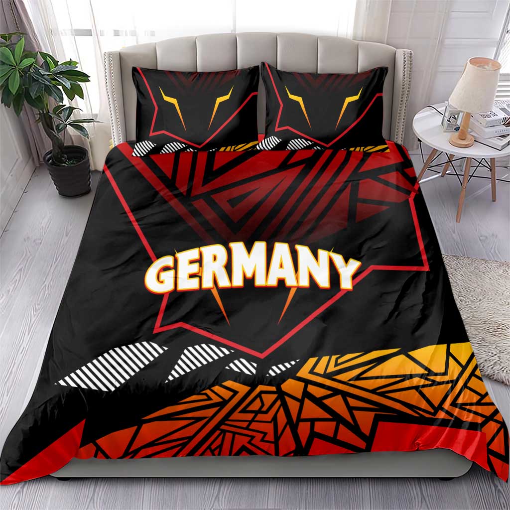 Germany eagle bedding set on bed, black with red and yellow geometric design; "GERMANY"