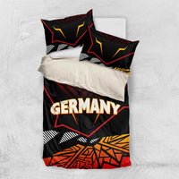 Germany eagle bedding set flat lay: black fabric with red and yellow geometric border