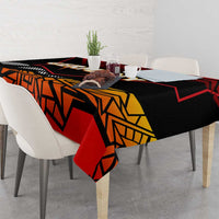 Geometric red and black tablecloth with Germany graphic, draped over table