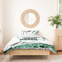 Nigeria duvet with white background, green flag shapes, and "NIGERIA" lettering; twin set.