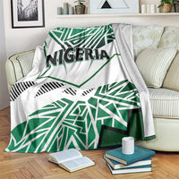 Nigeria flag blanket with white base and green geometric stripes, “NIGERIA” text center