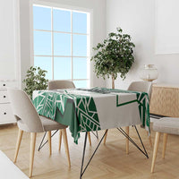 Nigerian flag tablecloth in green-and-white geometric pattern over dining table