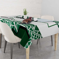 Nigerian flag tablecloth draped on dining table, green-and-white geometric design