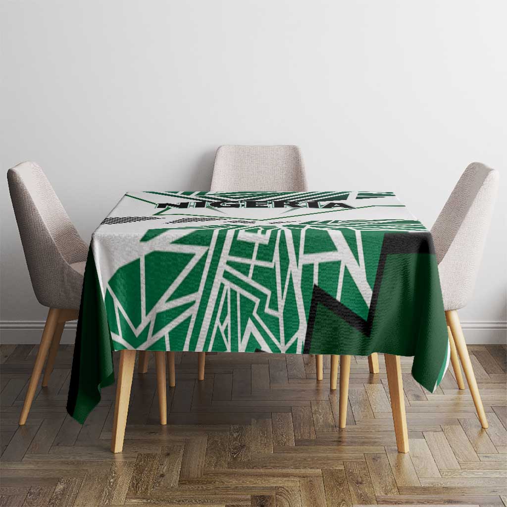 Nigerian flag tablecloth with green-and-white pattern on small dining table