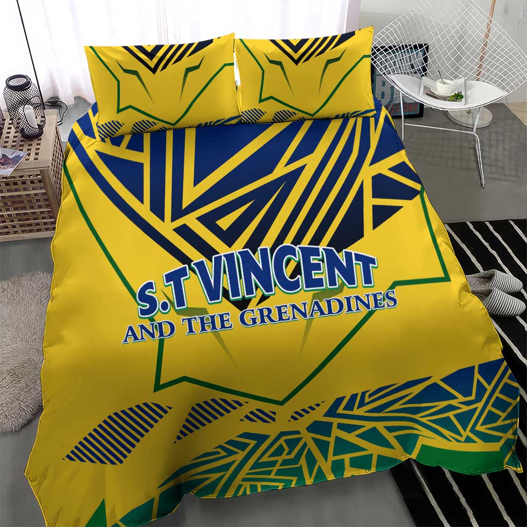 Yellow bedding set with duvet cover and pillowcases, blue-green geometric emblem text in center.