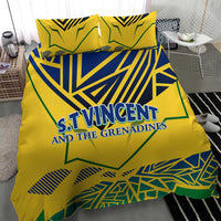 Yellow bedding set with duvet cover and pillowcases, blue-green geometric emblem text in center.