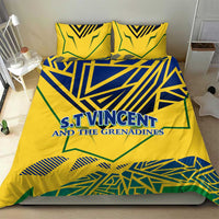 Yellow duvet cover set with two pillowcases, blue-green emblem and striped geometric patterns.