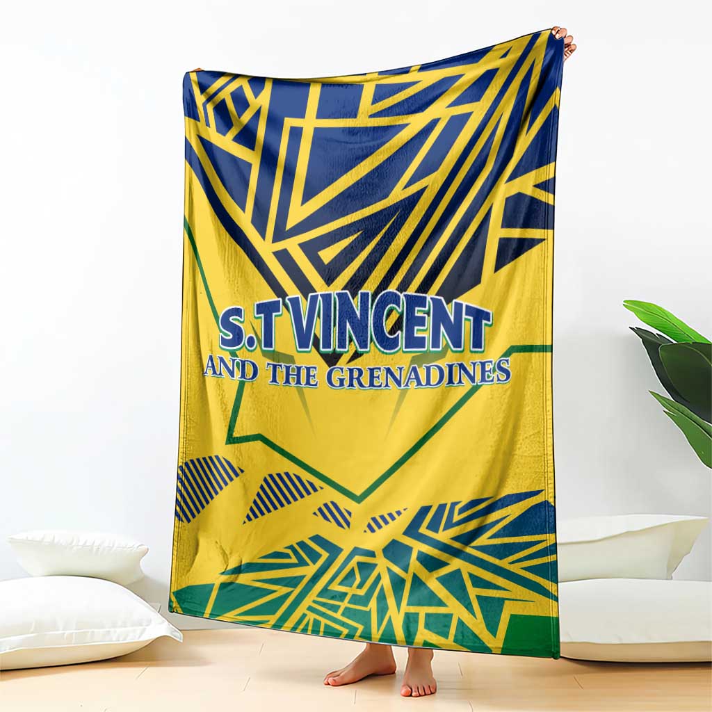 Yellow throw blanket with blue and green geometric design and centered 'S.T.Vincent' text