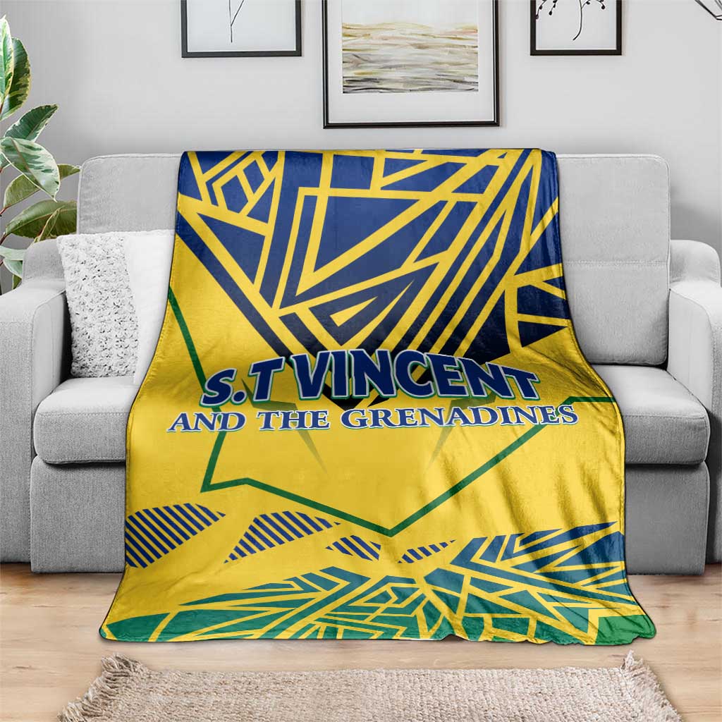 Yellow throw blanket with blue and green geometric print and 'S.T.Vincent and the Grenadines'