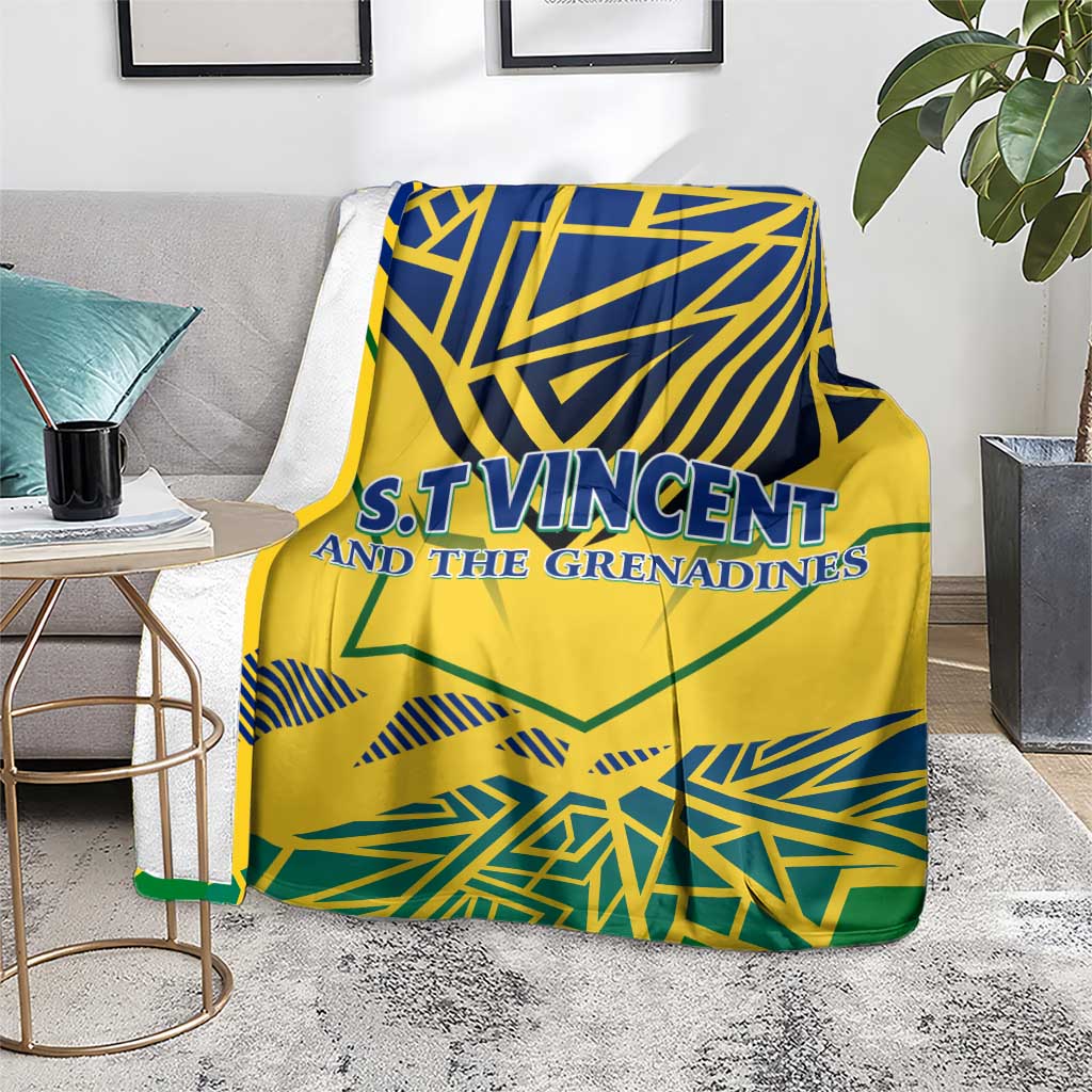 Yellow throw blanket with blue and green geometric print and 'S.T.Vincent and the Grenadines'