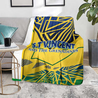 Yellow throw blanket with blue and green geometric print and 'S.T.Vincent and the Grenadines'