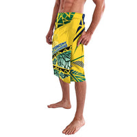 Yellow and green graphic lavalava-style shorts with blue waistband, side view