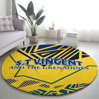 Round yellow carpet rug with blue geometric pattern and green shapes; S.T. Vincent lettering