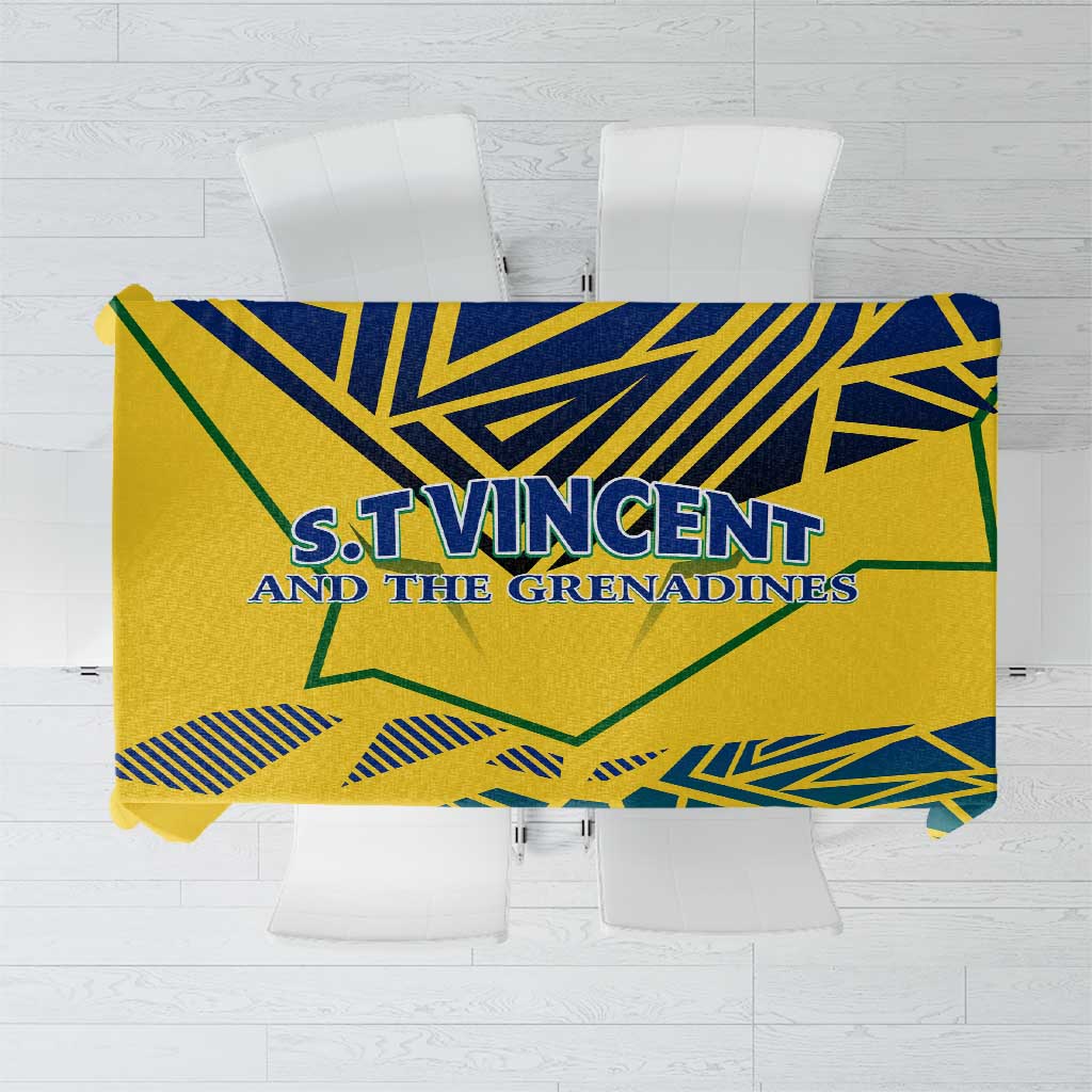 Yellow tablecloth with blue and green geometric print and peace/justice text