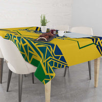 Yellow tablecloth with blue and green geometric pattern with folded corner drape
