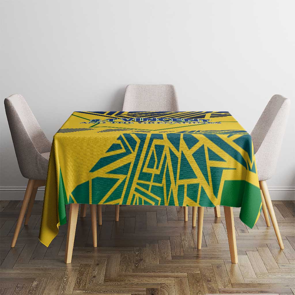 Yellow tablecloth with blue and green geometric pattern on dining table