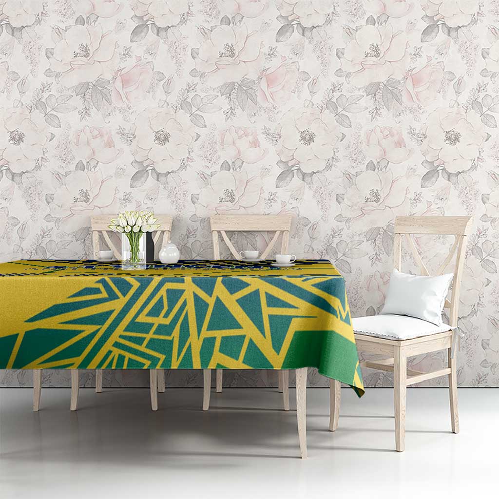 Yellow tablecloth with blue and green geometric pattern on long dining table
