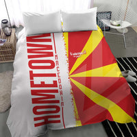 Macedonia bedding set with quilt showing flag rays in red and yellow beside white map stripe