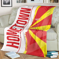 Macedonia flag and map blanket on couch, red and yellow flag panel with white side