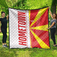 Quilted Macedonia quilt with flag colors and map graphic, shown spread outdoors