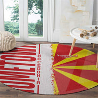 Round rug with red left wordmark, yellow flag rays, and white fringed center seam