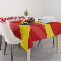Red, yellow tablecloth with Macedonia flag and map design over dining table, close view