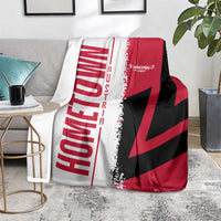Cuba flag-themed throw blanket in red, black and white over gray seating