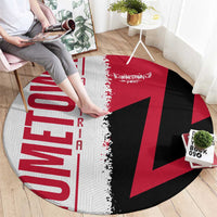 Round red, black, and white carpet on the floor with map and star flag print