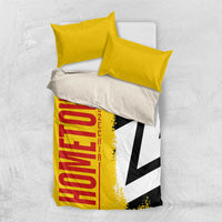 Yellow bedding set with red "Germany" text, black-white flag panel, and yellow pillows
