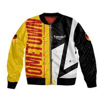 Unisex bomber jacket in black with yellow red flag graphic and central zip front