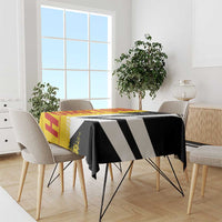 Rectangular Germany-themed tablecloth draped on table, yellow-red flag side and black-white stripe side