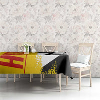 Germany-themed tablecloth on dining table, yellow-red flag area with black-and-white map graphic