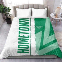 Green and white Nigeria flag bedding set on bed with two matching pillowcases