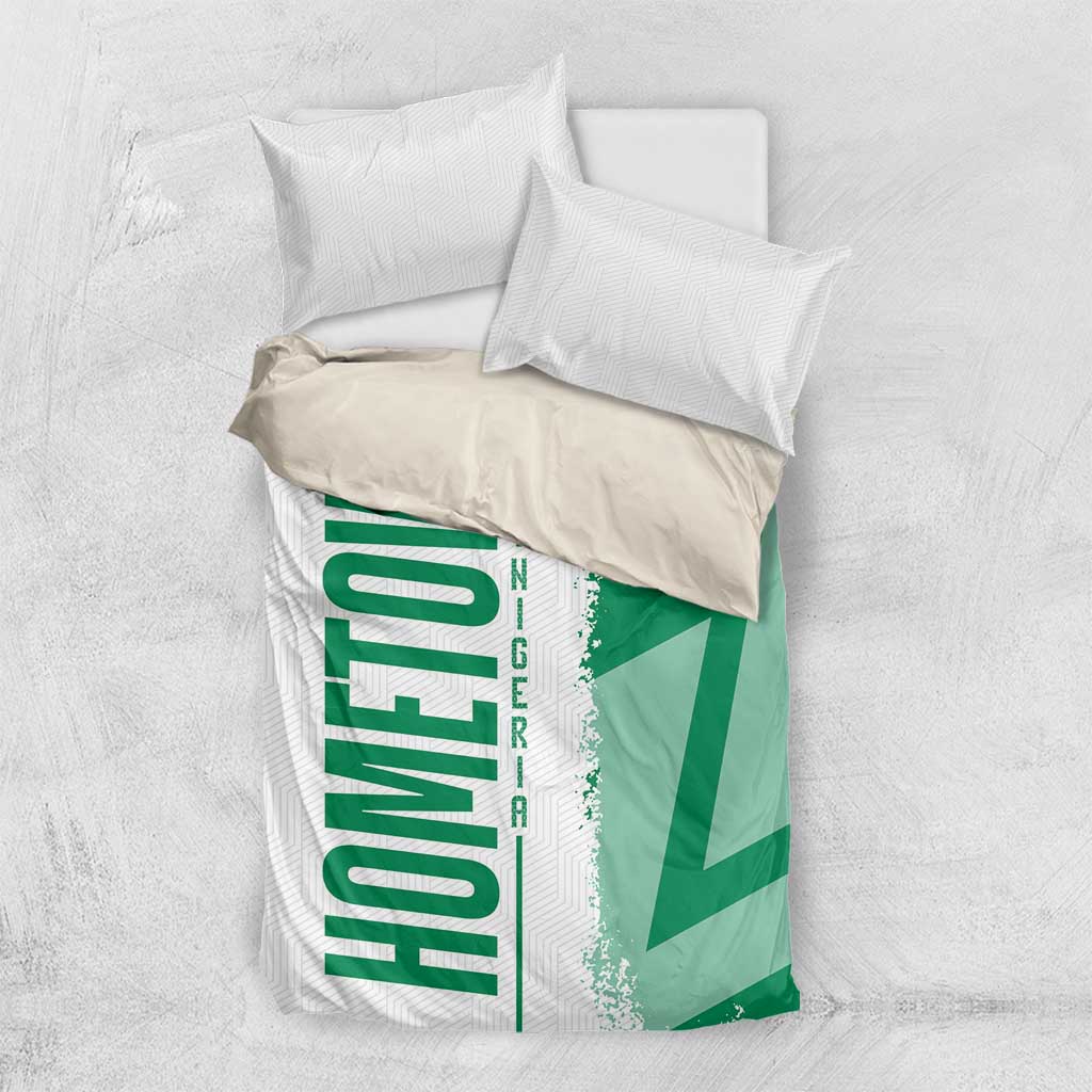 Green Nigeria flag bedding set top view showing duvet and pillowcases with “NIGERIA” panel