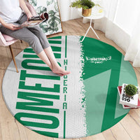 Round Nigeria flag map rug in green and white with white dotted map stripe and 'NIGERIA'