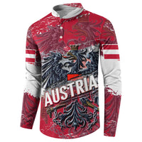 Red button sweatshirt with large AUSTRIA text and detailed eagle crest on the chest