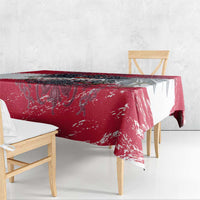 Red grunge-style tablecloth featuring Austria crest, draped over table edge