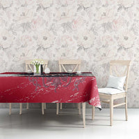 Red grunge-style tablecloth with Austria crest graphic across dining table