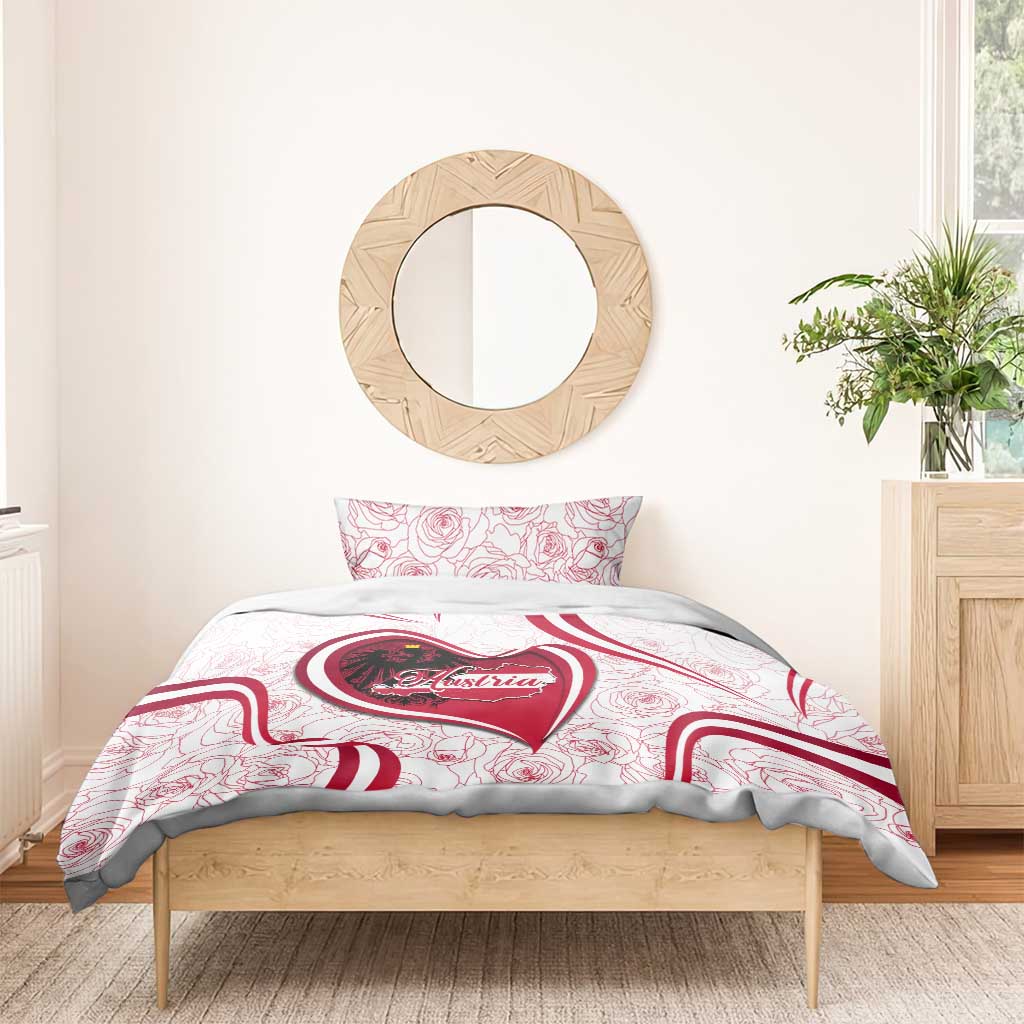 White bedding set with Austria heart emblem on duvet and two red rose-pattern pillowcases