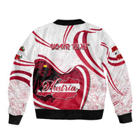 White bomber jacket with red 'Austria' graphic text, striped patterns, ribbed cuffs