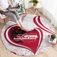 Round red and white Austria heart rug with eagle and Austria lettering, curved spiral border