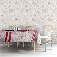 Red and white tablecloth with rose line art and Austria-inspired crest on dining table