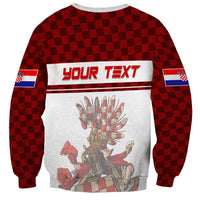 Red checkerboard sweatshirt with YOUR TEXT banner, crest emblem, and flag sleeve prints