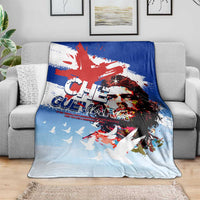 Cuba Che Guevara blanket on sofa, light blue with Che portrait, red accents, white doves