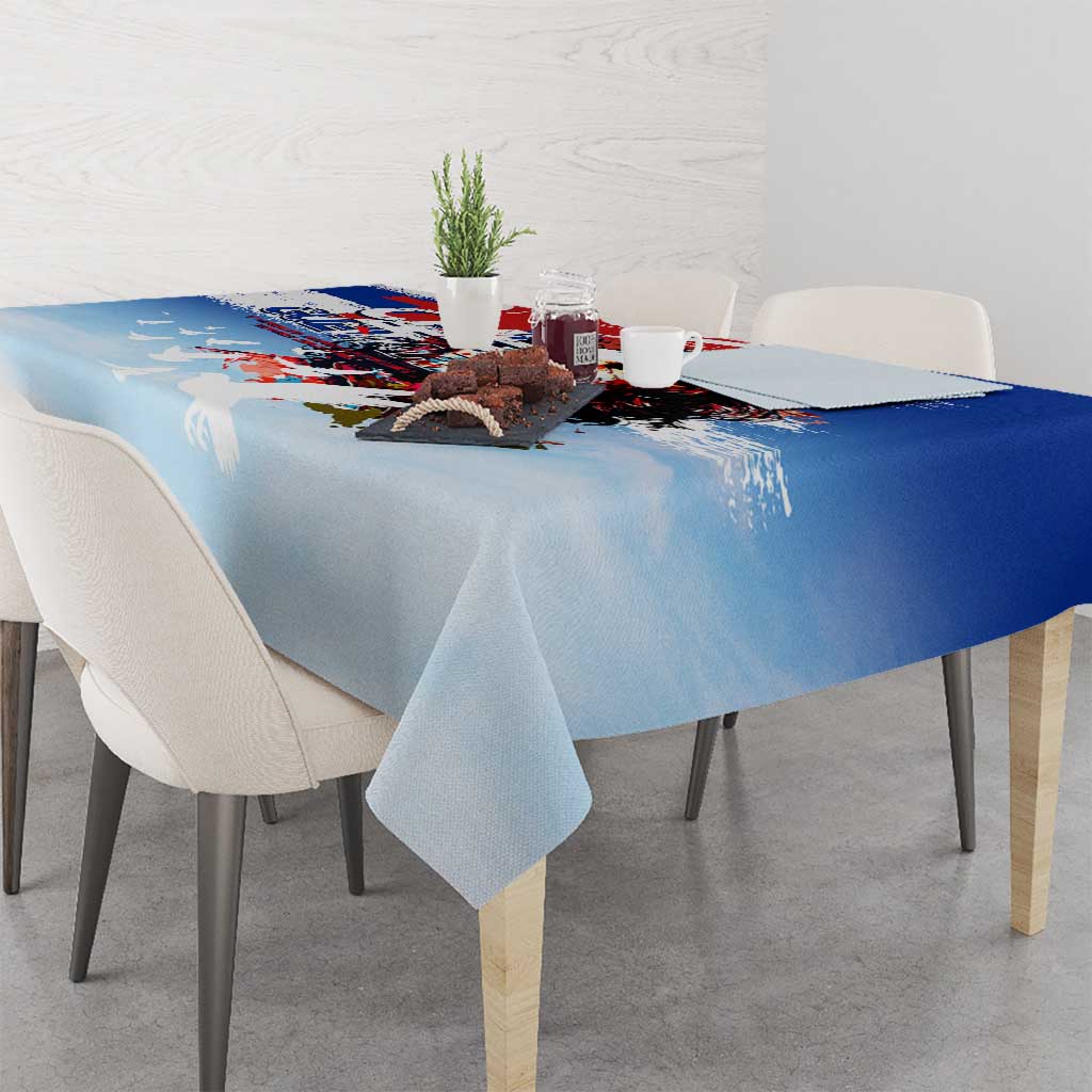 Blue tablecloth with Che Guevara portrait graphic, light distressing, and white splatter.