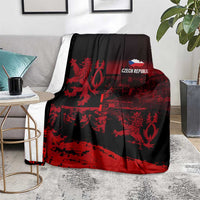 Black and red lion print blanket with 'CZECH REPUBLIC' logo, laid over chair
