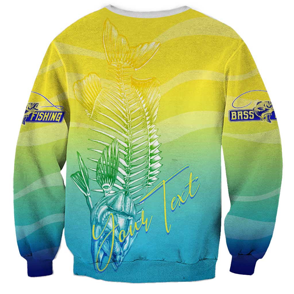 Unisex fishing-themed sweatshirt, yellow-to-blue gradient, fish skeleton wings graphic on back