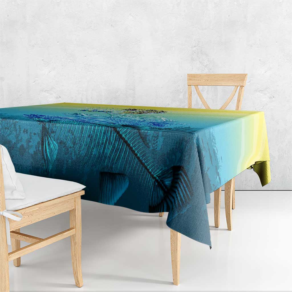 Teal-blue fish tablecloth with yellow edge panel and detailed fish print