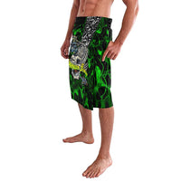 Green patterned sarong with central skull artwork and fish accents, elastic waist